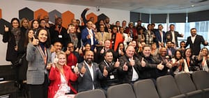 Alderman James Vos, the City’s Mayoral Committee Member for Economic Growth, in a group photo with the EXL team.