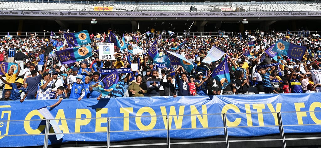 Cape Town City fans cheer for their team at a game at DHL Stadium