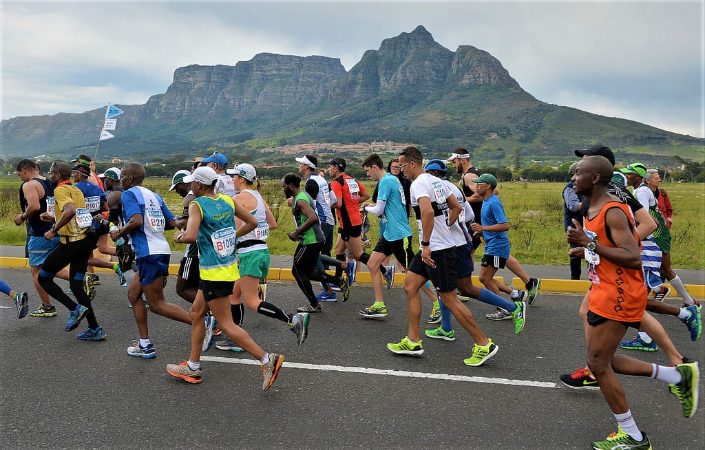 Sanlam Cape Town Marathon runners go past Rondebosch Common