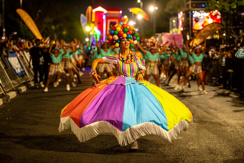 A carnival performer on the parade in 2025