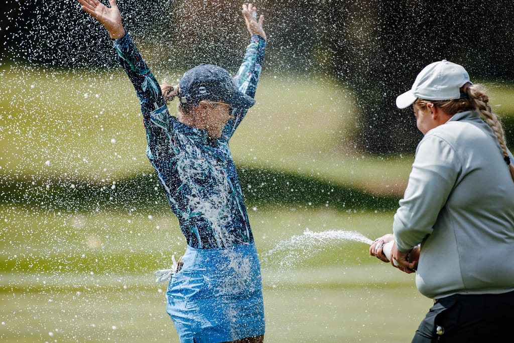 Cara Gorlei is splashed with champagne after her Jabra Ladies Open victory