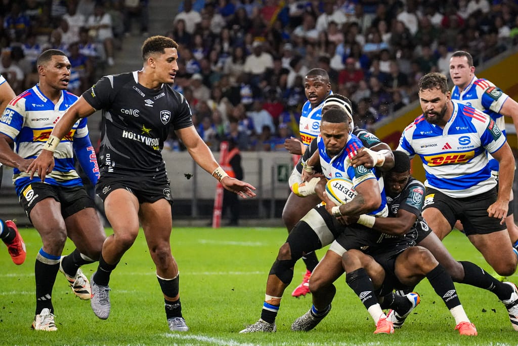 DHL Stormers winger Leolin Zas is tackled by Sharks players on his way to a try
