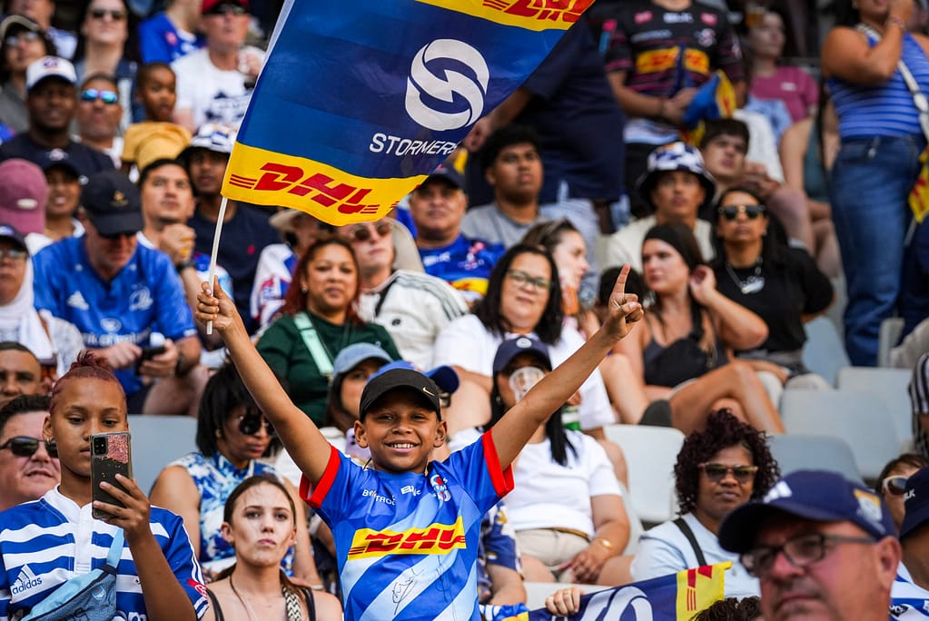A Stormers fan hoists a flag at DHL Stadium where the Stormers will host the Glasgow Warriors in April.