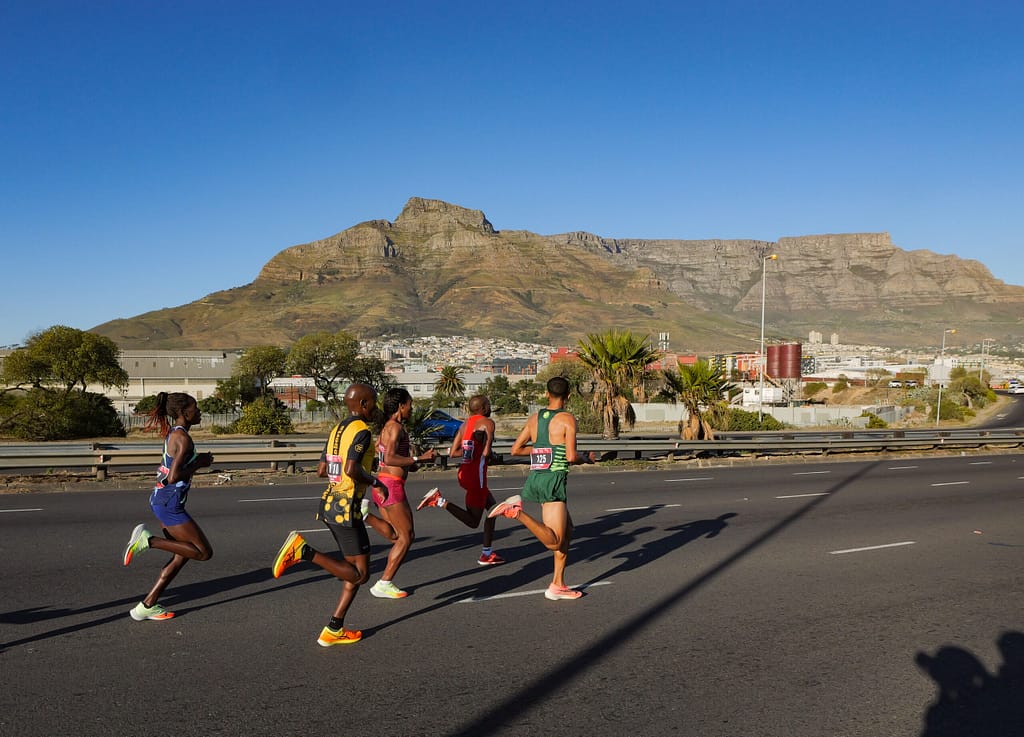 A group of Absa Run Your City Cape Town 10K elite runners on the N1 headed for the CBD