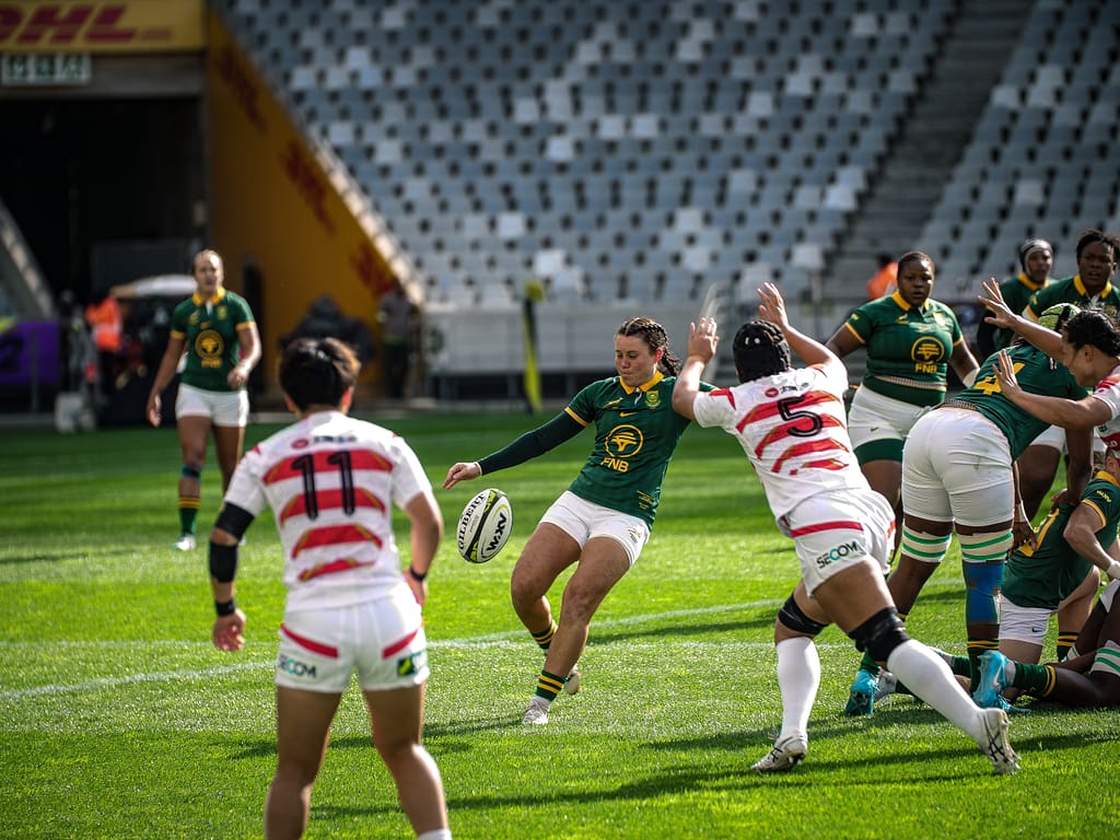 Springbok Women scrumhalf Tayla Kinsey kicks a high ball against Japan at DHL Stadium