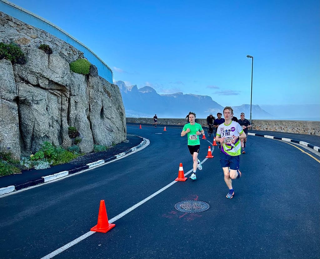 Man and Woman running on road in Cape Town