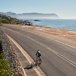 A cyclist rides in Simon’s Town, one of South Africa’s oldest and most picturesque towns, set to host the Cape Point Triathlon
