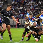 DHL Stormers winger Leolin Zas is tackled by Sharks players on his way to a try