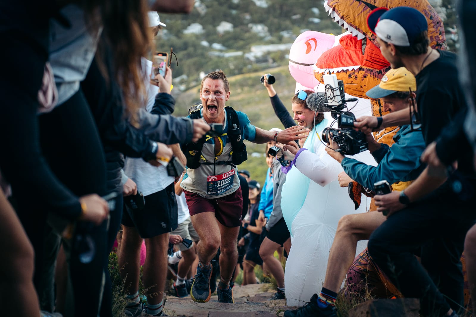 Trail runner passing through UTCT Spectator zone