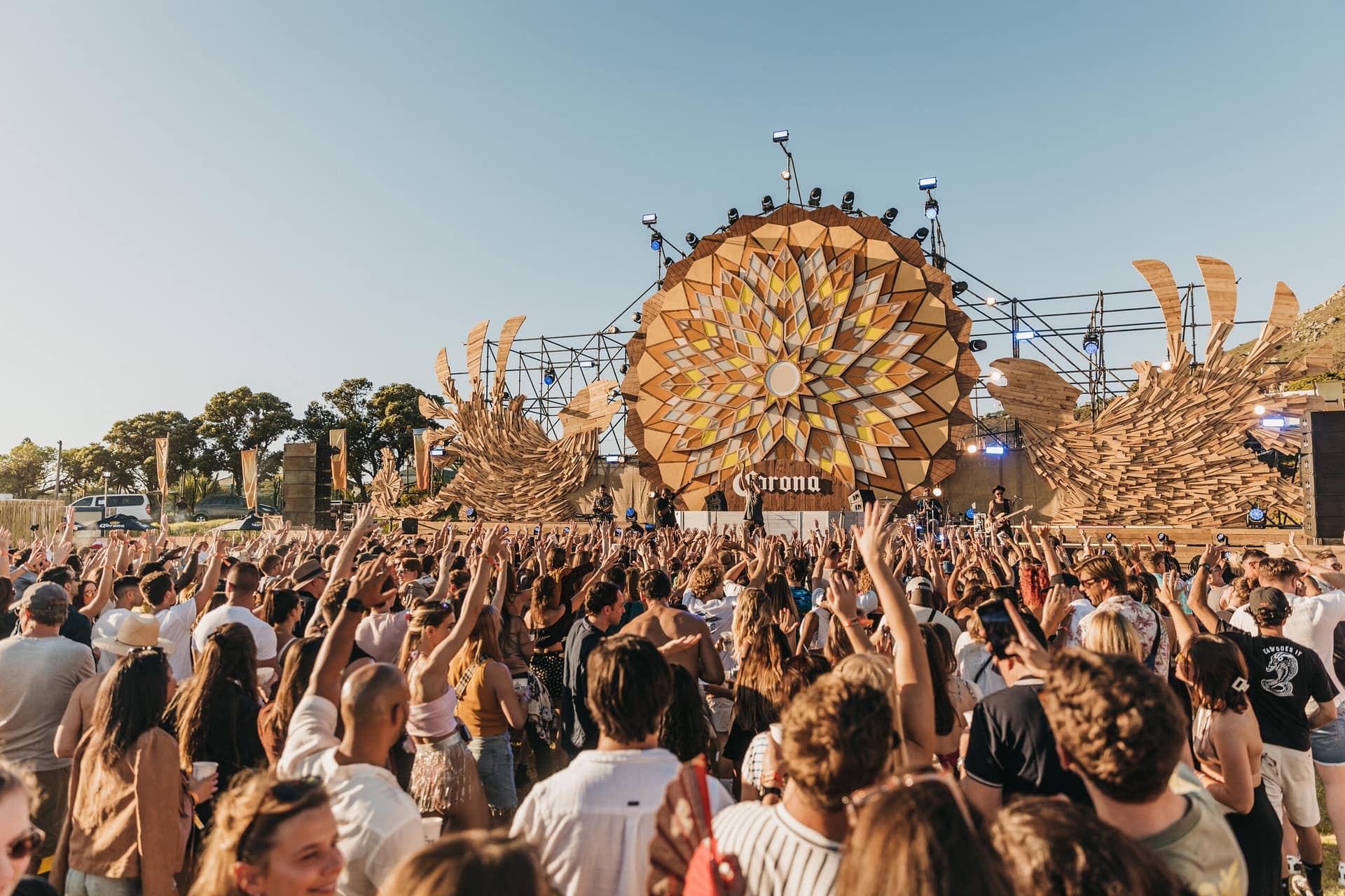 Crowd of men and women in front of Corona Sunsets main stage