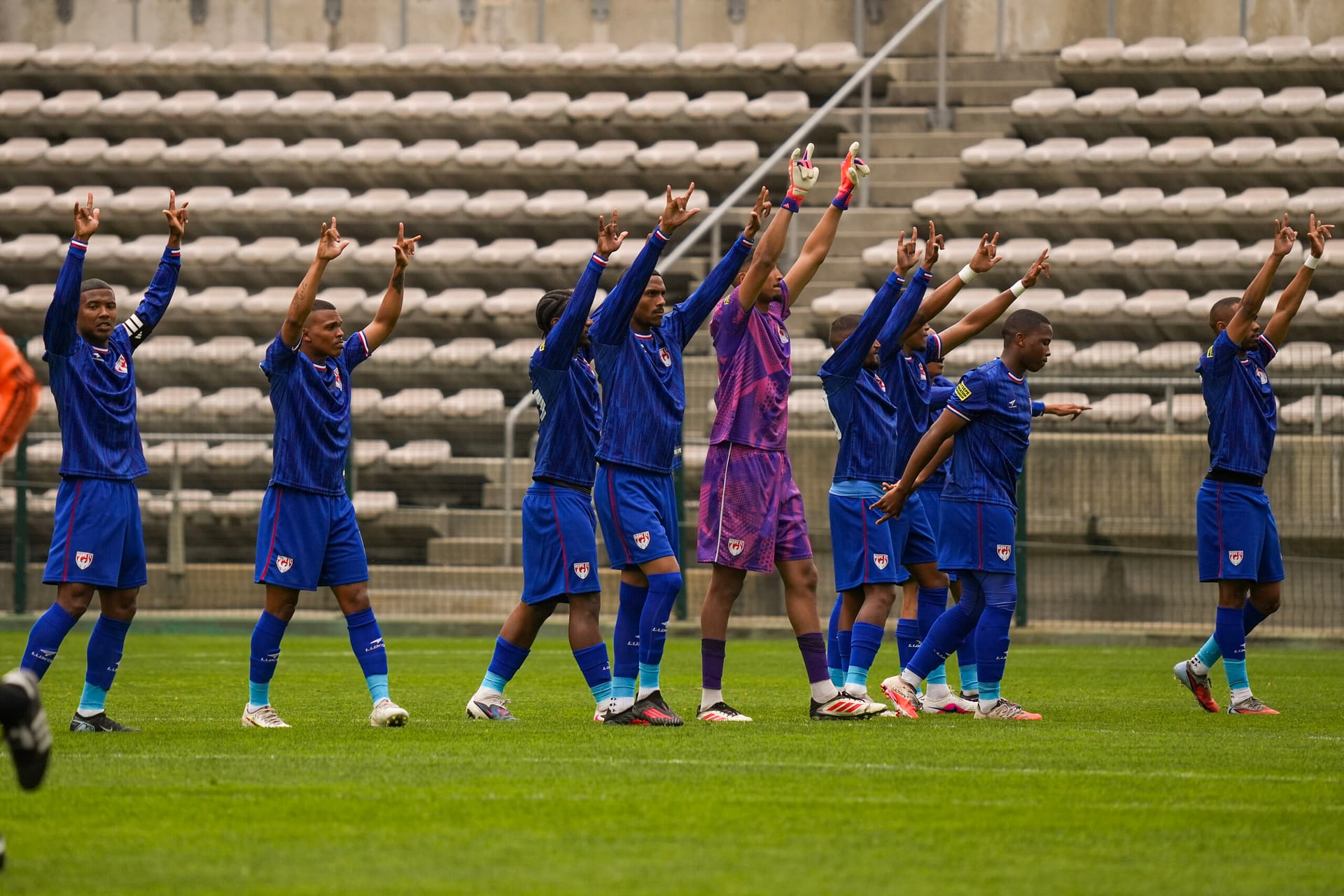 Hope FC players greet their fans ahead of a game in Athlone Stadium