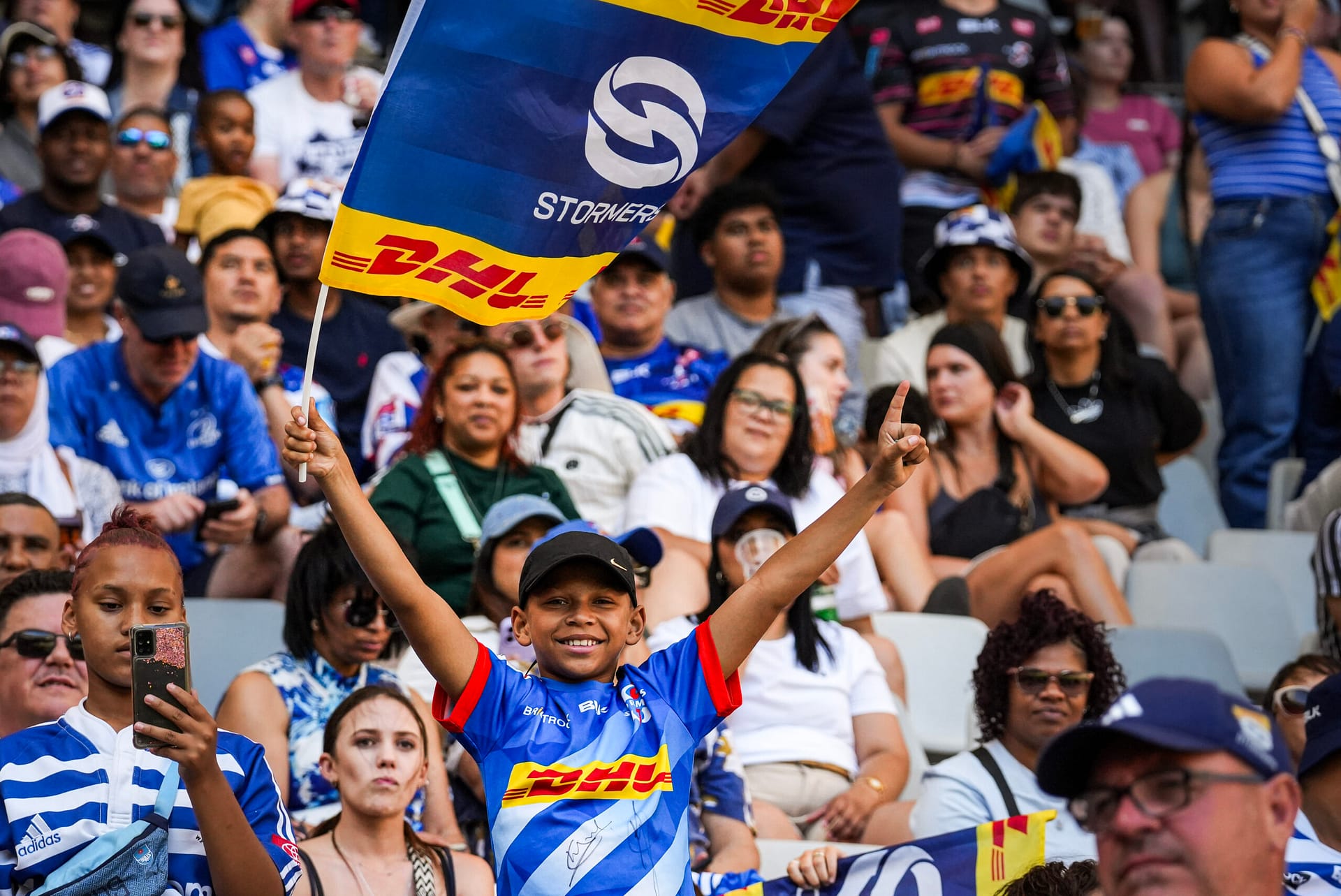 A Stormers fan hoists a flag at DHL Stadium where the Stormers will host the Glasgow Warriors in April.
