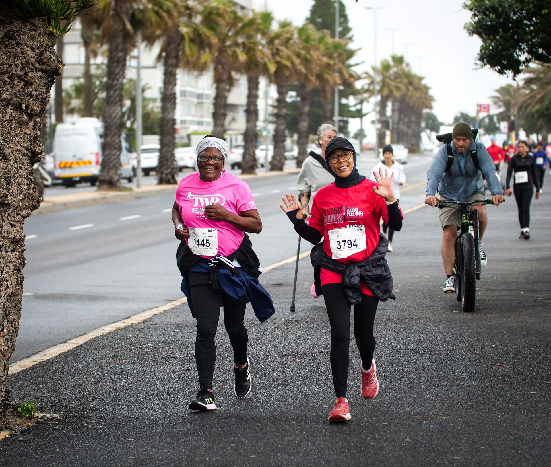 Two ladies running on along the promenade in Sea Point
